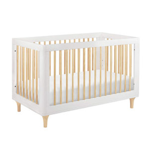 white and wood crib