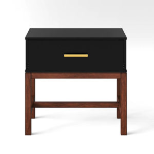 black modern night table with gold pulls is the perfect nightstand for an elegant black and white themed bedroom