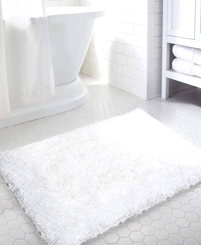 plush white bath mat for a cozy bathroom