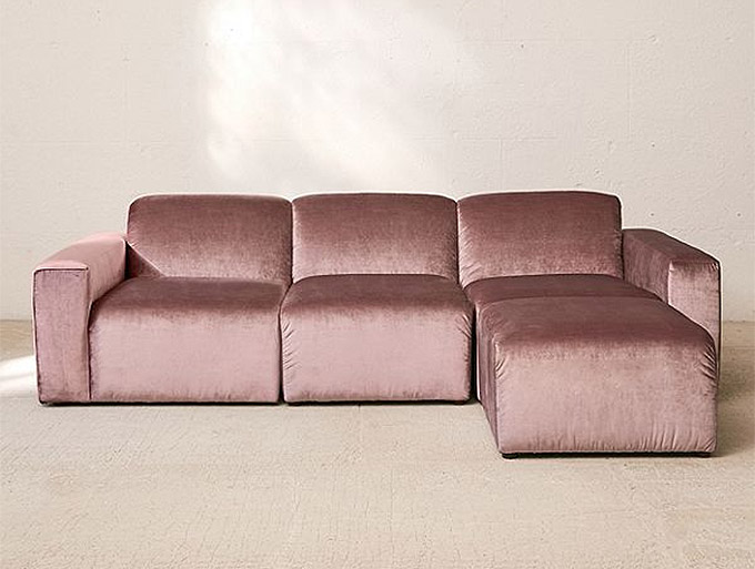 this modular velvet sofa from urban outfitters is a great affordable sofa for under $1000 