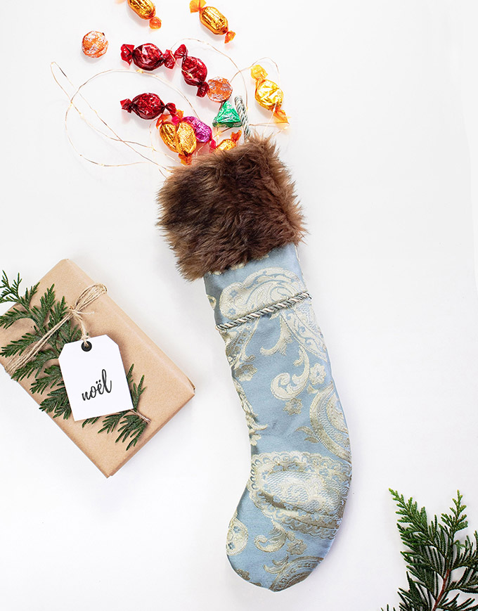 easy and fast DIY christmas stocking made from a pillowcase bought at the second hand store, upcycled faux fur was used as a cuff
