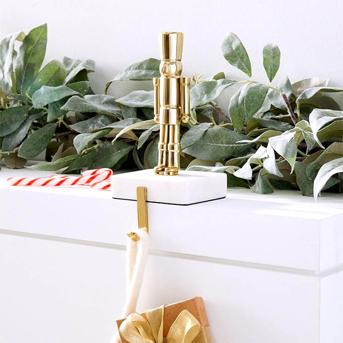 stocking holder in the form of a brass solider, from west elm
