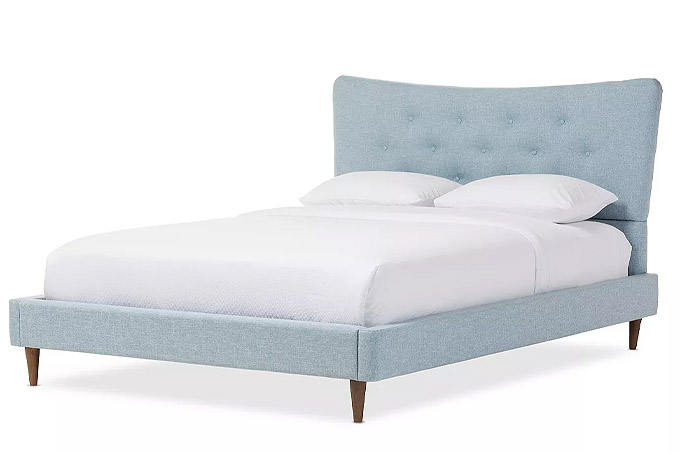 wingback mid century bed with light blue upholstery