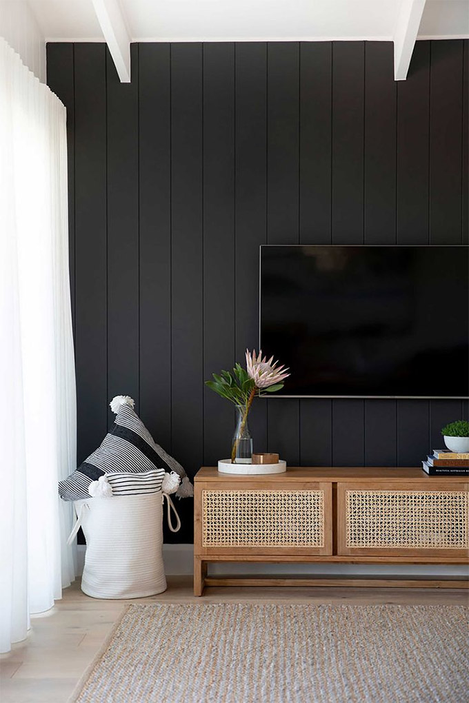 a tv placed in front of a dark wall is a classic tv wall idea