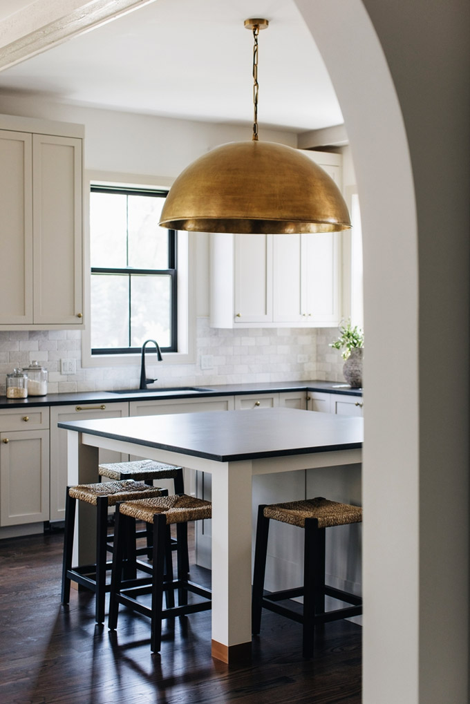 incredible lighting fixture in a modern farmhouse kitchen
