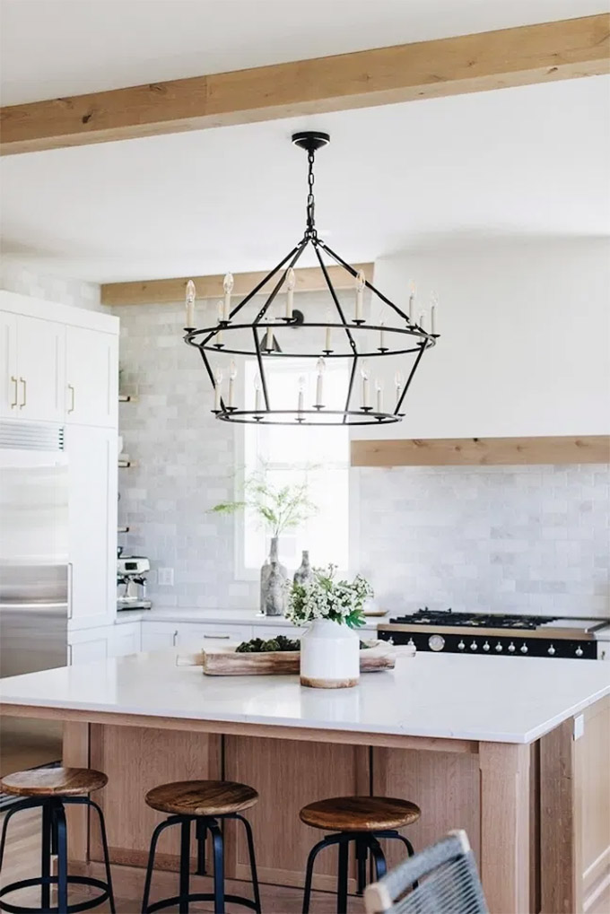 beautiful oversized lighting fixture in a modern farmhouse kitchen