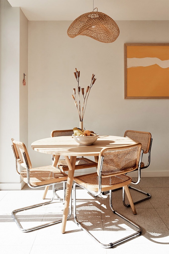 cesca chairs surrounding a pale wood round table