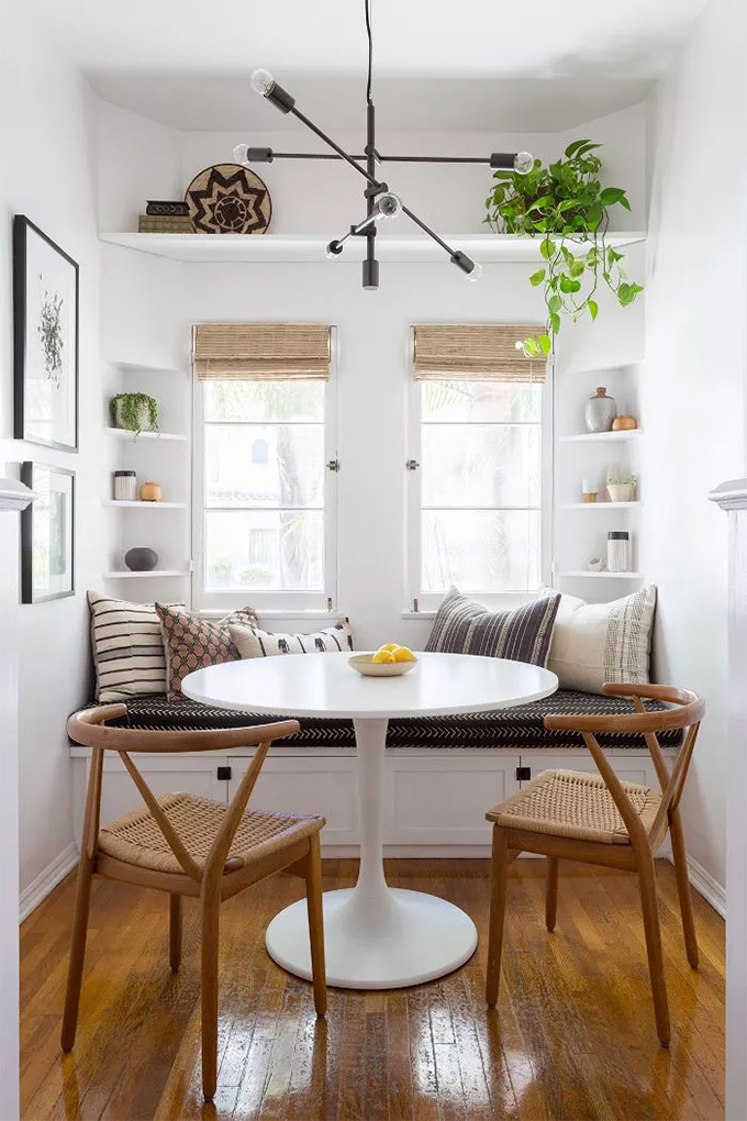 benjamin moore simply white used in a breakfast nook with a white tulip table