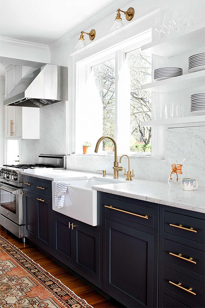 gold faucets in a spruced up rental kitchen