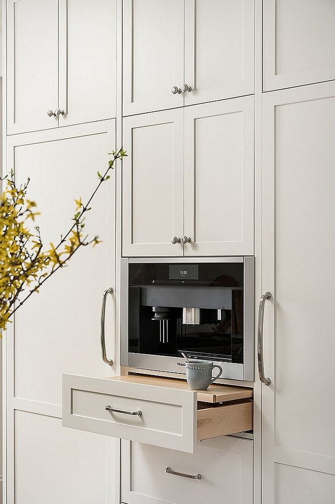beautiful clean kitchen cabinetry featuring polished chrome hardware