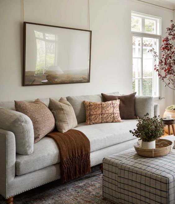 warm neutral throw pillow combination on a light gray sofa