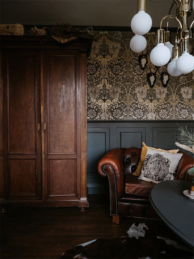 beautiful moody traditional space with rich moods, wall paneling and William Morris style wallpaper