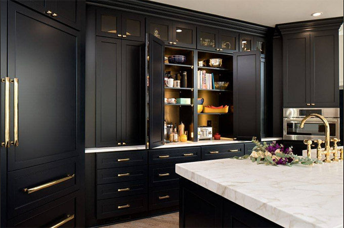 unlacquered brass hardware in a black kitchen sold by my knobs