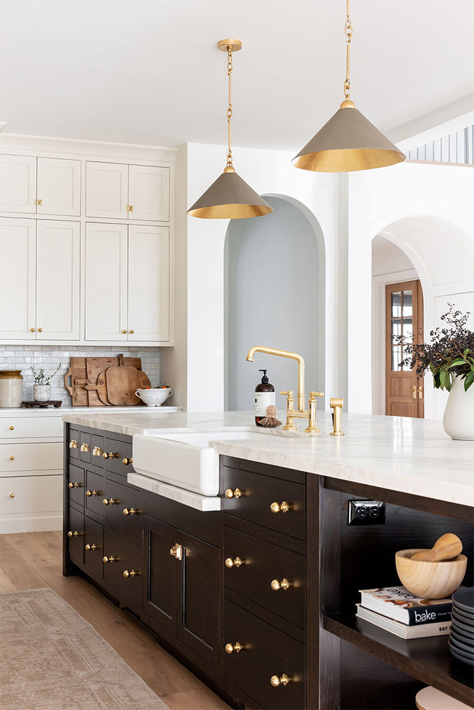 Unlacquered brass hardware used in a kitchen designed by Studio McGee