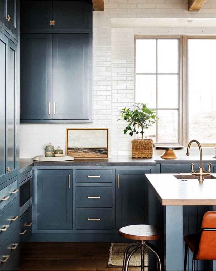 navy blue cabinetry in white kitchen