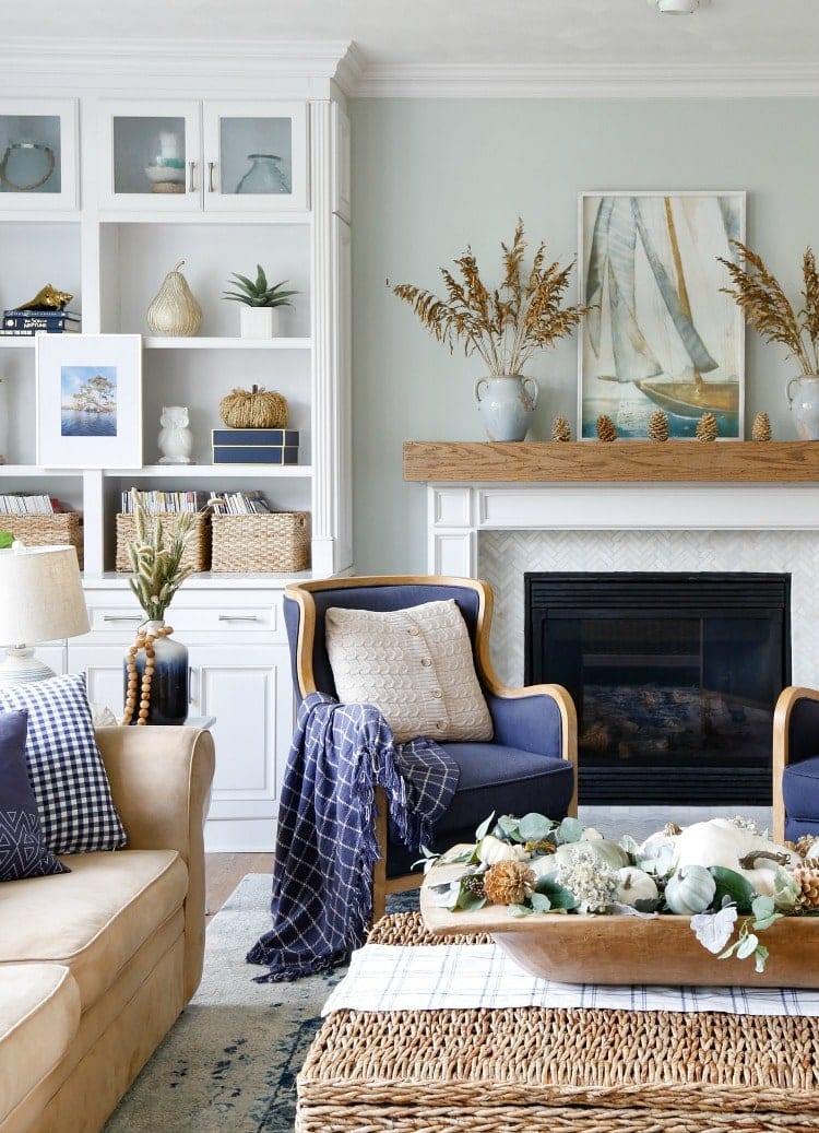 nautical themed living room with light blue walls and white trim