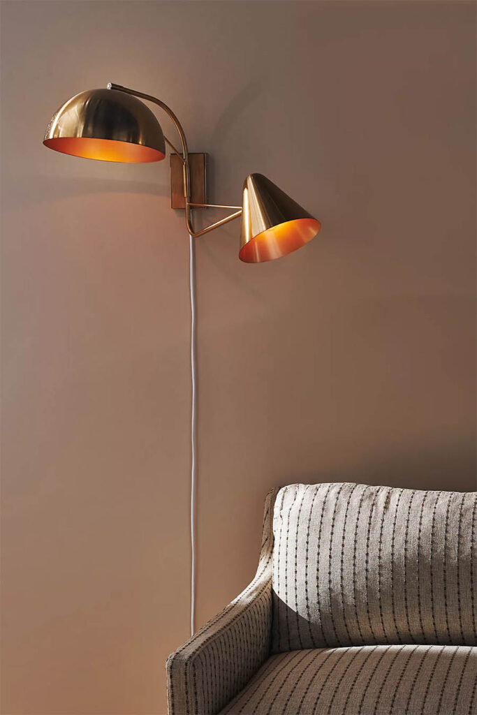asymmetrical gold wall sconce from anthopologie