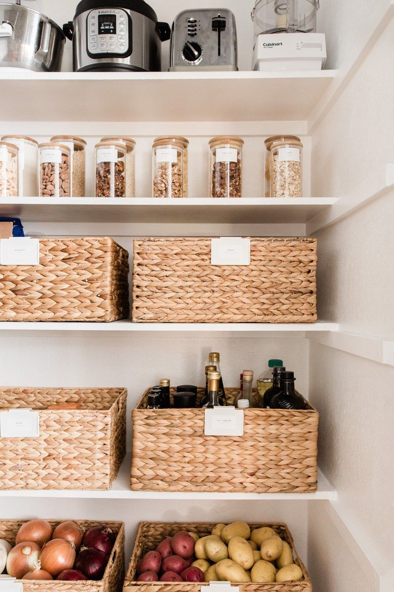 baskets help to organize and make the kitchen look more luxurious