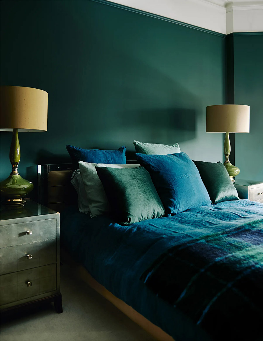 green bedroom with teal and green velvet bedding