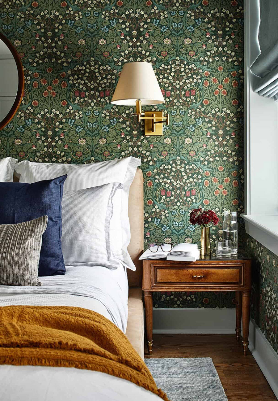 green patterned wallpaper in eclectic bedroom