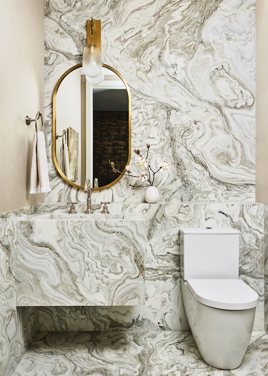mixed metal bathroom with predominant marble finishes