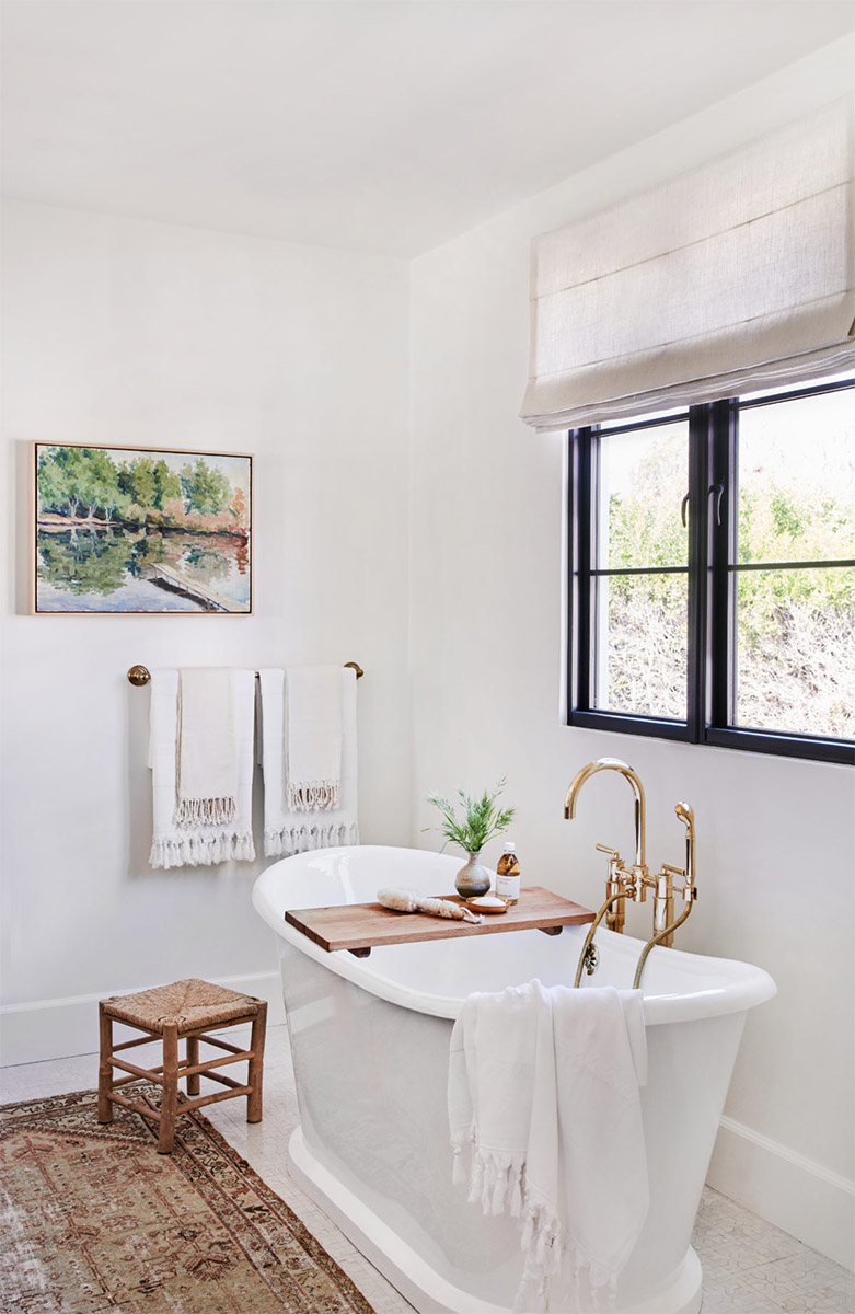 free standing tub in a bathroom painted in swiss coffee by amber interiors