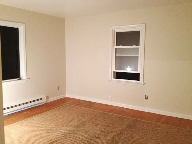 a bedroom painted benjamin moore martime white, a paint color with pinky beige undertones