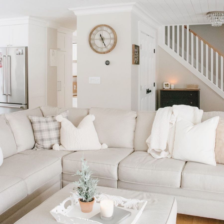 neutral modern farm house living room with BM Edgecomb Gray painted walls and cream sofa